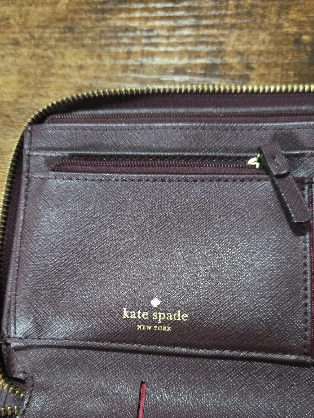 kate spade deep plum Saffiano zip-around leather wallet
